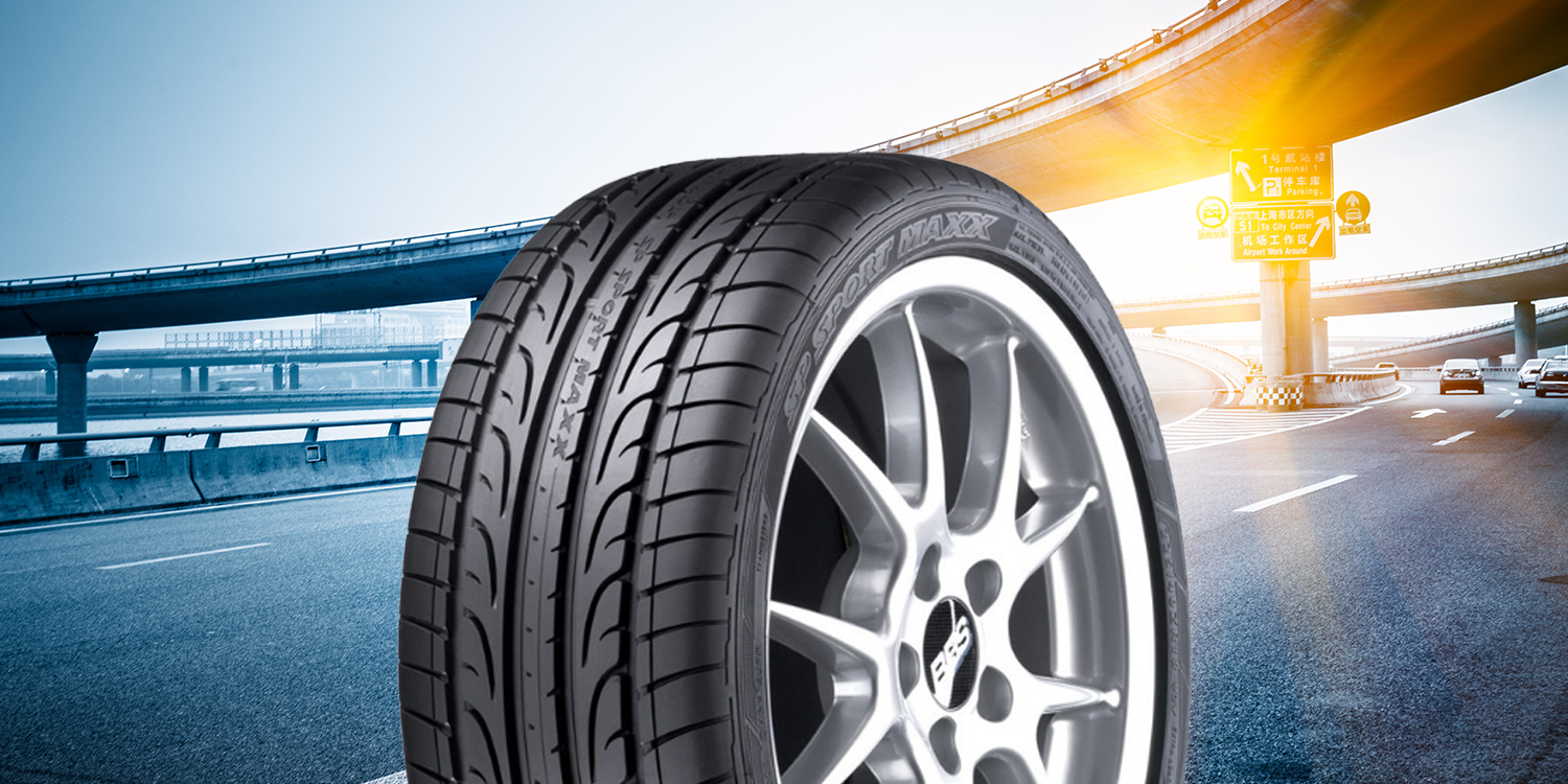 Dunlop tire image in front of a roadway