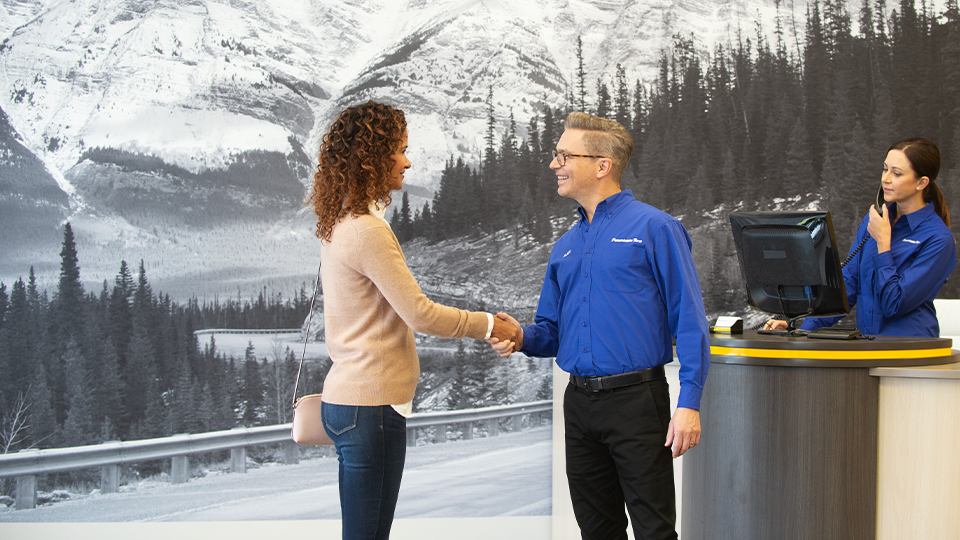 Employee shaking customers hand