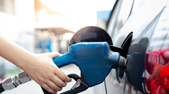 Hand pumping gas in vehicle